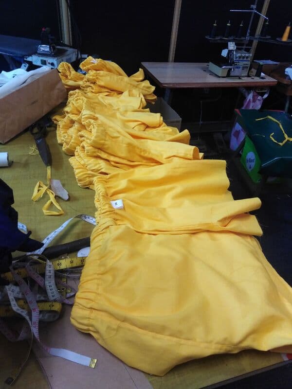 Yellow sports shorts laid out ready for sewing